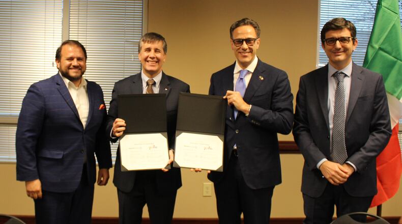 Gwinnett Chamber President & CEO Nick Masino, Gwinnett Chamber Board Chair Doug Jenkins, Honorary Consul General of Italy in Atlanta Filiberto Calascibetta and Vice President of the Georgia Chapter, Italy-America Chamber of Commerce Southeast Eugenio Fumo sign an agreement to collaborate. (Courtesy Gwinnett Chamber)