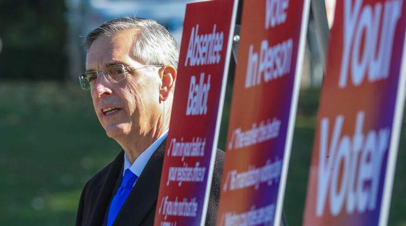 Georgia Secretary of State Brad Raffensperger spoke in Piedmont Park in front of the Park Tavern where long lines plagued voting during the June 9 primary. Raffensperger said the state is ready for Tuesday's election and said that, so far, it "has gone very well. But no election is perfect, he warned. "Tomorrow," he said, "we’ll have challenges.” (John Spink / John.Spink@ajc.com)