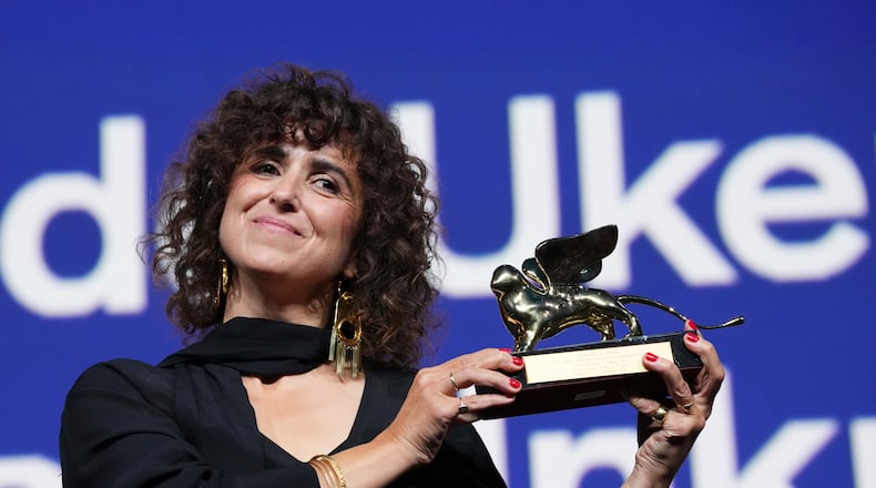 Director May el-Toukhy poses for photographers after receiving the Golden Lion for best film for 'Woman Unknown' during the closing ceremony of the 83rd edition of the Venice Film Festival in Venice, Italy, on Saturday, Sept. 12, 2026. (Photo by Scott A Garfitt/Invision/AP)