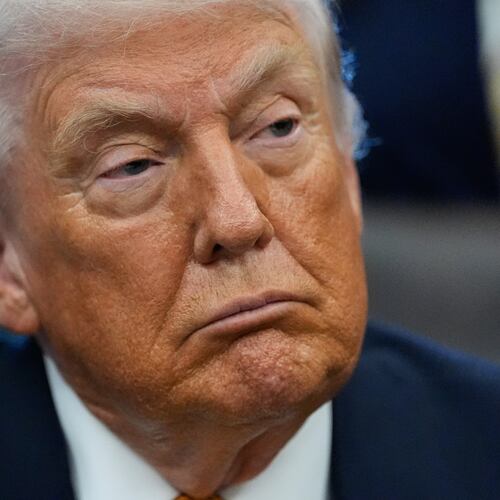 President Donald Trump listens in the Oval Office of the White House, Wednesday, Jan. 14, 2026, in Washington. (AP Photo/Alex Brandon)