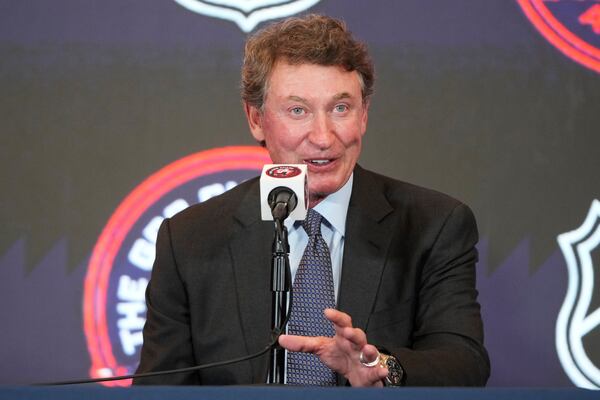 Former NHL player Wayne Gretzky speaking during a press conference after an NHL hockey game in which Washington Capitals Alex Ovechkin tied Gretzky's NHL career goals record of 894th goals, Friday, April 4, 2025, in Washington.(AP Photo/Mark Schiefelbein)