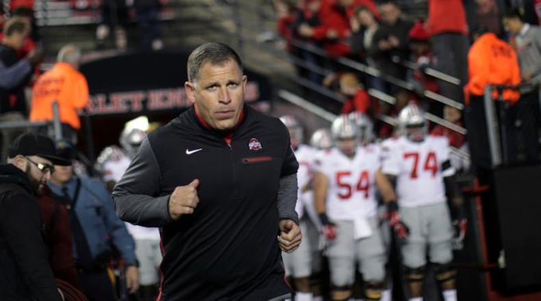 FILE- This Sept. 30, 2017 file photo shows former Rutgers football head coach, now Ohio State associate head coach/defensive coordinator Greg Schiano running onto the field before an NCAA college football game against Rutgers in Piscataway, N.J. Ohio State coach Urban Meyer says Tennessee has contacted Schiano about its head coaching vacancy. Meyer didn't have any additional details about Tennessee's potential interest in his defensive coordinator. Tennessee is seeking a new coach after firing Butch Jones two weeks ago. Schiano posted a 68-67 record as Rutgers' coach from 2001-11. (AP Photo/Mel Evans, file)