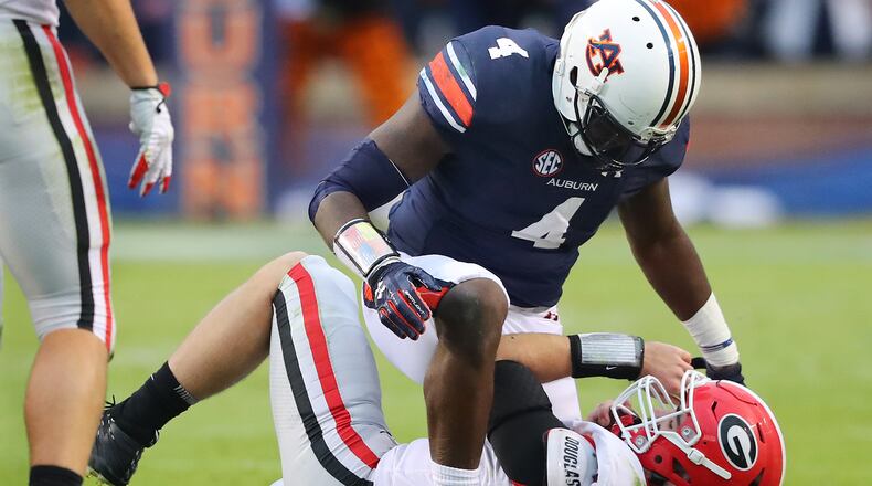 November 11, 2017 Auburn: Auburn linebacker Jeff Holand tackles Georgia quarterback Jake Fromm during the first half of the game at Jordan-Hare Stadium November 11, 2017, in Auburn. Curtis Compton/ccompton@ajc.com