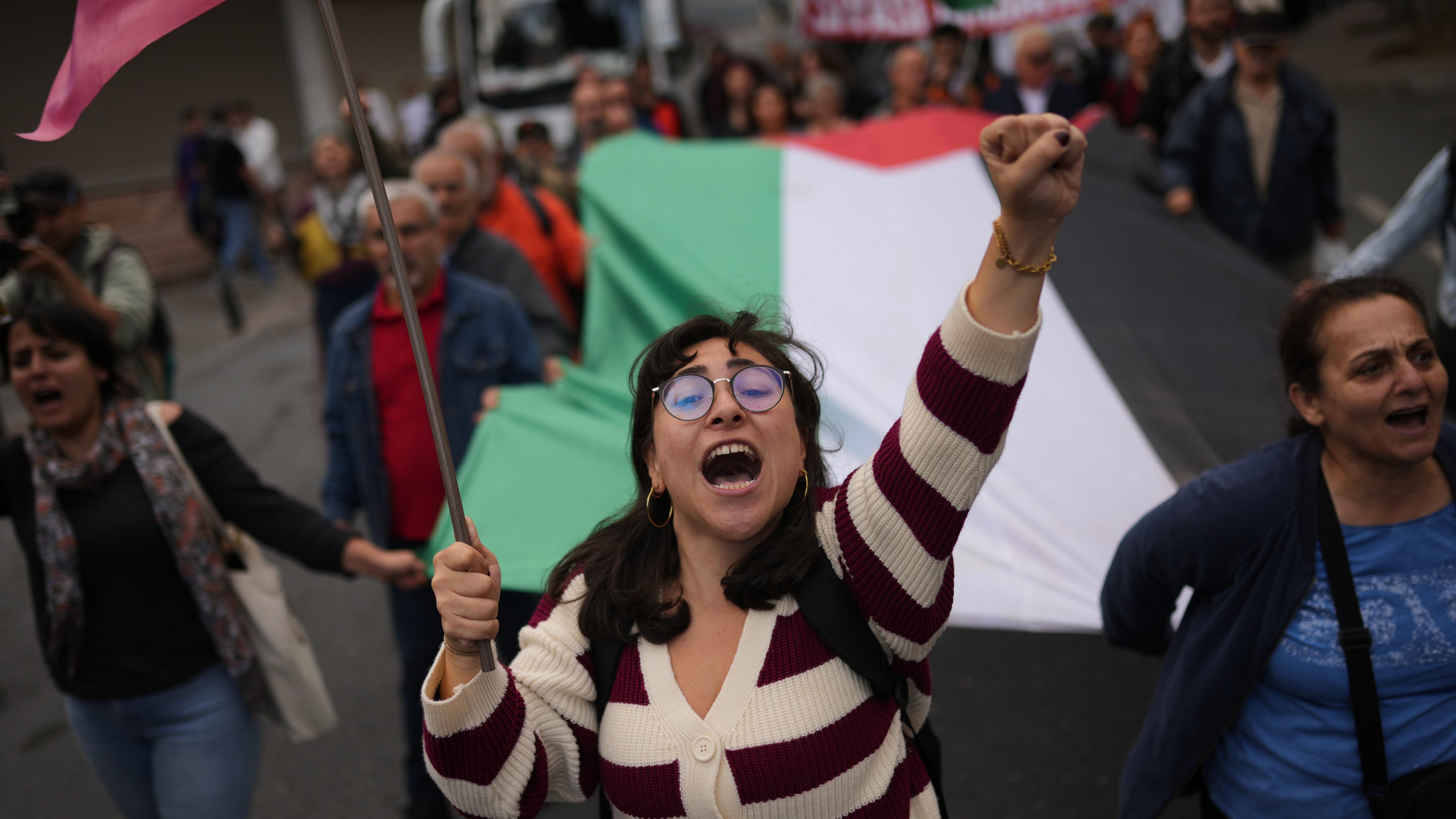 People march during a pro-Palestinian protest in Istanbul, Turkey, Sunday, Oct. 5, 2025. (AP Photo/Francisco Seco)