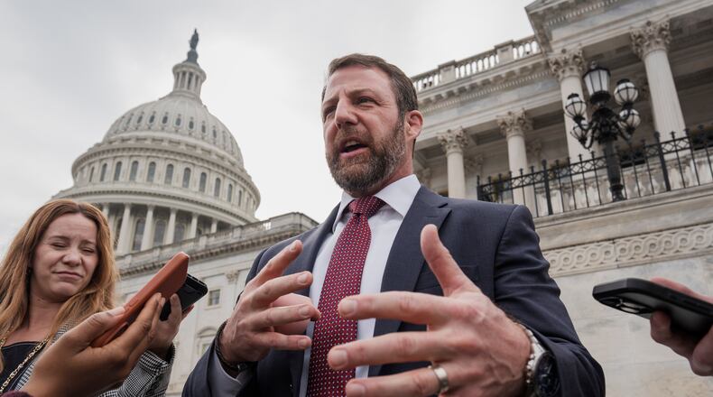FILE - Sen. Markwayne Mullin, R-Okla., speaks with reporters on the steps at the Capitol in Washington, Thursday, March 5, 2026. (AP Photo/J. Scott Applewhite, File)