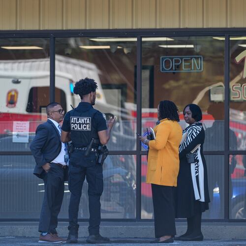 Atlanta police and homicide detectives stand outside Walter’s Soul Food Cafe after a body was found at the restaurant on Monday, Sept. 14, 2026. (Ben Hendren for the AJC)