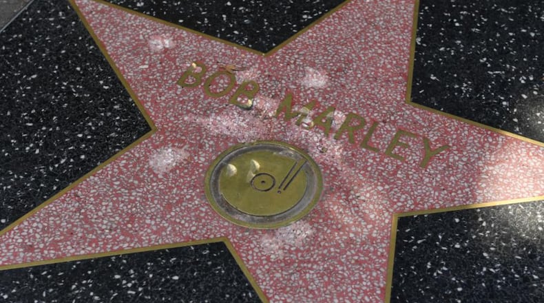 The damaged Hollywood Walk of Fame star of reggae musician Bob Marley is seen after it was vandalized with a hammer in Hollywood, California on October 24, 2017.
The reggae artist died in 1981 was posthumously awarded the star,located at 7080 Hollywood Blvd in 2001. (MARK RALSTON/AFP/Getty Images)