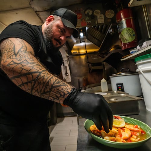 Sea Wolf head chef Justin Waldman prepares a dish with fresh local shrimp at his restaurant on Tybee Island, Ga., Friday, Aug. 14, 2026. (Justin Taylor/The Current GA/CatchLight/Report for America via AP)