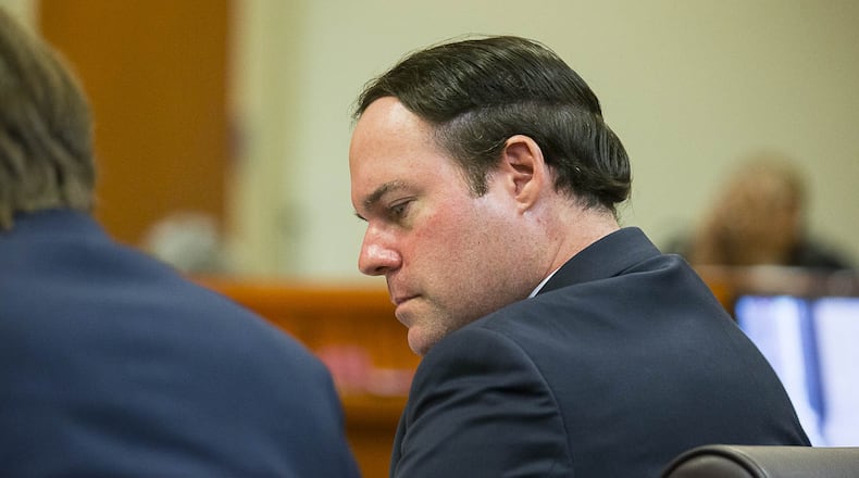 Georgia Department of Revenue attorney Alex Sponseller sits with his team in the courtroom of Judge Alan C. Harvey at the DeKalb County Courthouse in Decatur. (ALYSSA POINTER/ALYSSA.POINTER@AJC.COM) AJC FILE PHOTO