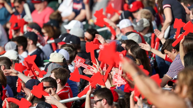Braves Fans tomahawk chop during the season opener game against the Philadelphia Phillies Thursday, March 29, 2018, in Atlanta.