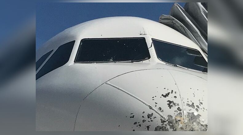 A Delta flight from Atlanta to Haiti made an emergency landing in Florida after the windshield was struck by hail.
