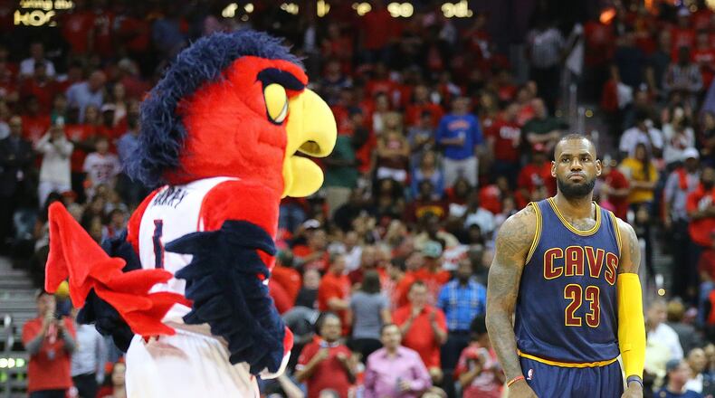 Mascot Harry the Hawk and Cavaliers LeBron James stare down just before tip off in Game 2 of the Eastern Conference Finals last season in Atlanta. Curtis Compton / ccompton@ajc.com