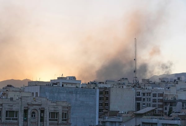 Smoke rises up after Israel's attack, in Tehran, Iran, Wednesday, June 18, 2025. (AP Photo/Vahid Salemi)