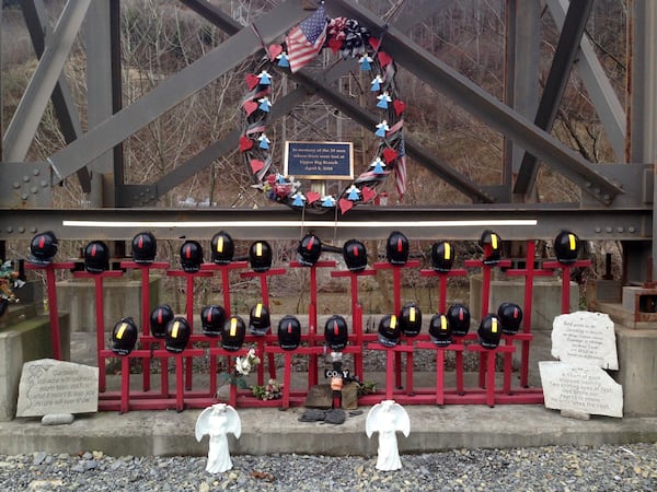 FILE - A memorial to 29 miners killed in a 2010 explosion stands at the entrance to the Upper Big Branch mine in Montcoal, W.Va., Dec. 3, 2015. (AP Photo/John Raby, File)