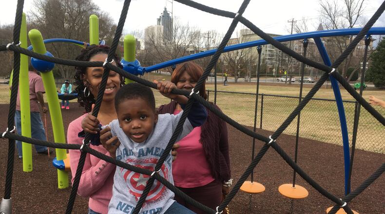 Monique Smith, left, with her 4-year-old, Michael, and mom, Earleen McLain, at the playground outside the MLK National Historic Site. Photo: Jennifer Brett