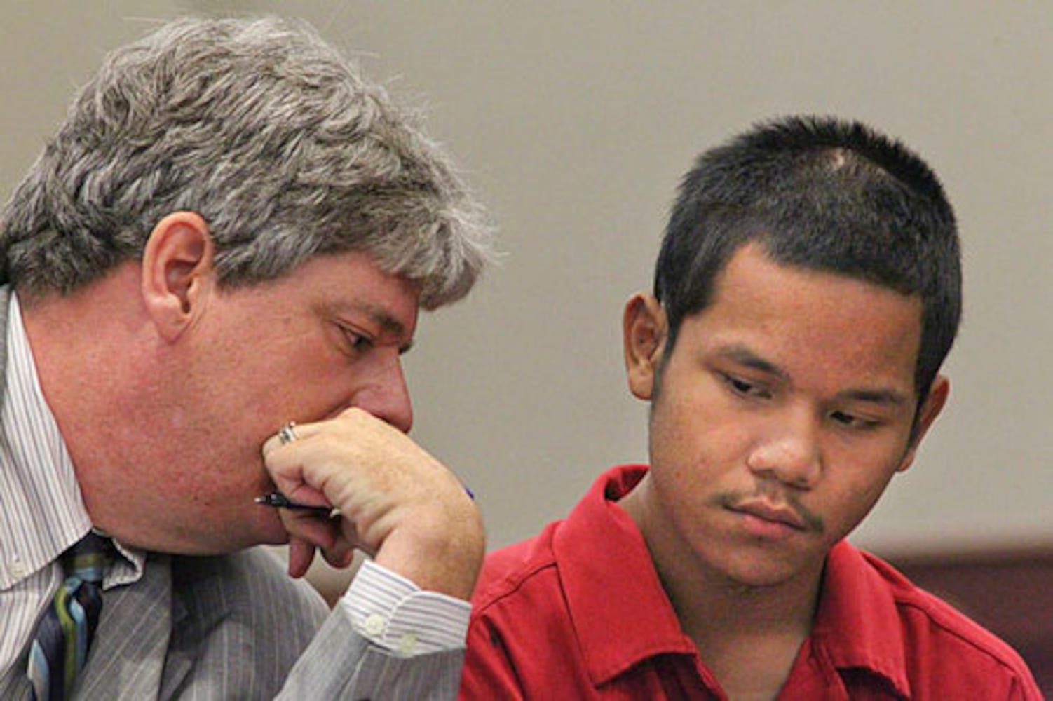 Teen in court, accused of killing cop