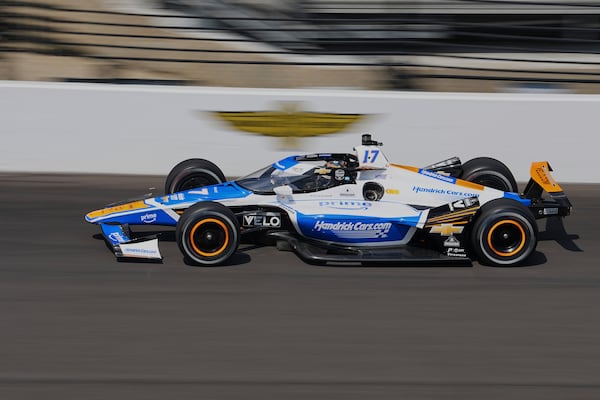 Tony Kanaan, of Brazil, drives into the first turn area during practice for the Indianapolis 500 auto race at Indianapolis Motor Speedway in Indianapolis, Thursday, May 15, 2025. (AP Photo/Michael Conroy)
