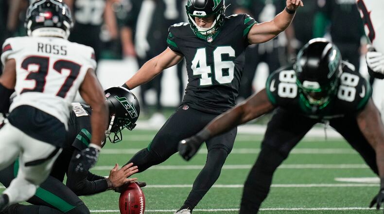 New York Jets kicker Riley Patterson (46) makes the kick for an extra point during the second half of an NFL football game against the Houston Texans, Thursday, Oct. 31, 2024, in East Rutherford, N.J. (AP Photo/Seth Wenig)