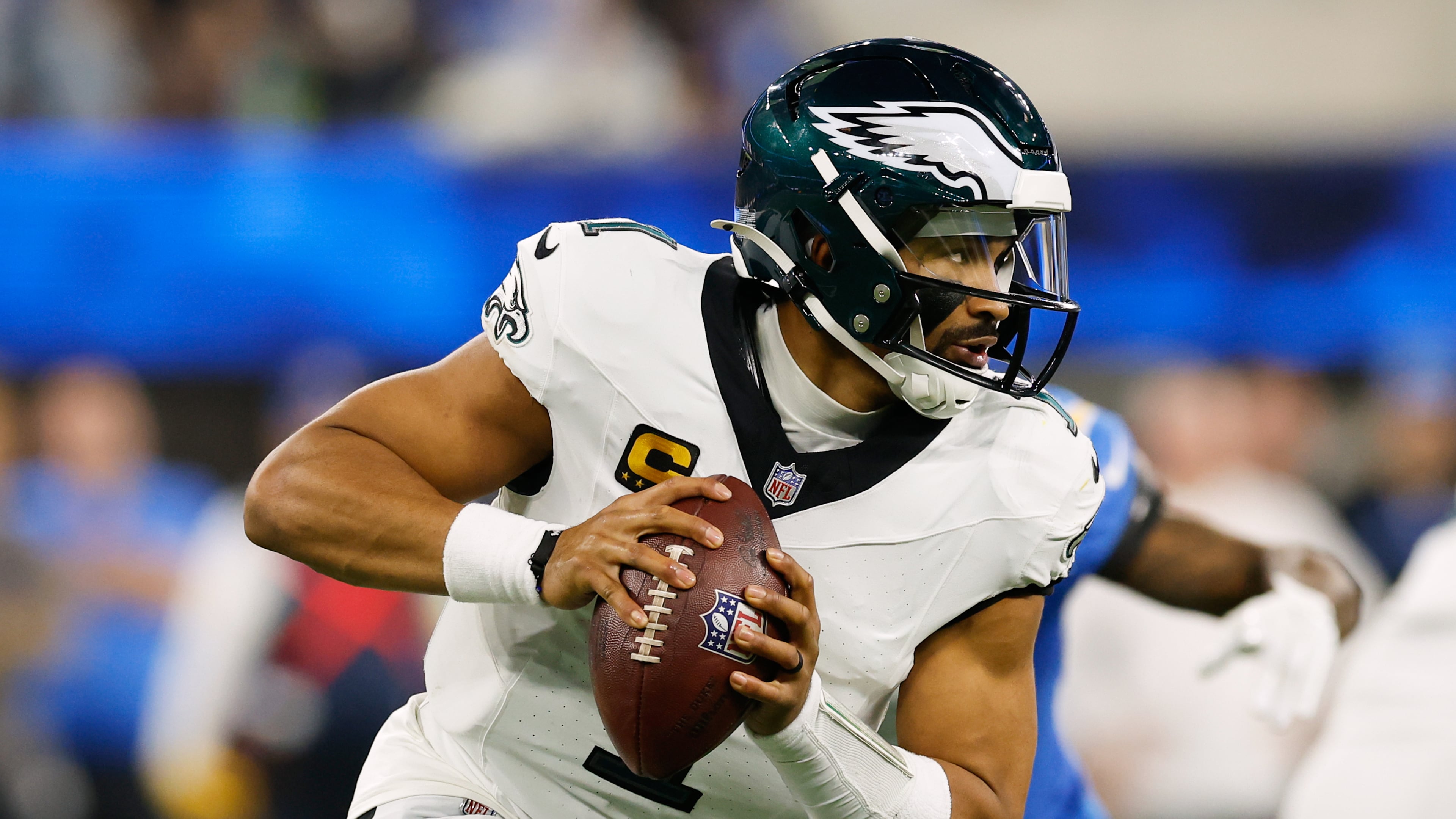 Philadelphia Eagles quarterback Jalen Hurts (1) rolls out during the second half of an NFL football game against the Los Angeles Chargers, Monday, Dec. 8, 2025, in Inglewood, Calif. (AP Photo/Caroline Brehman)