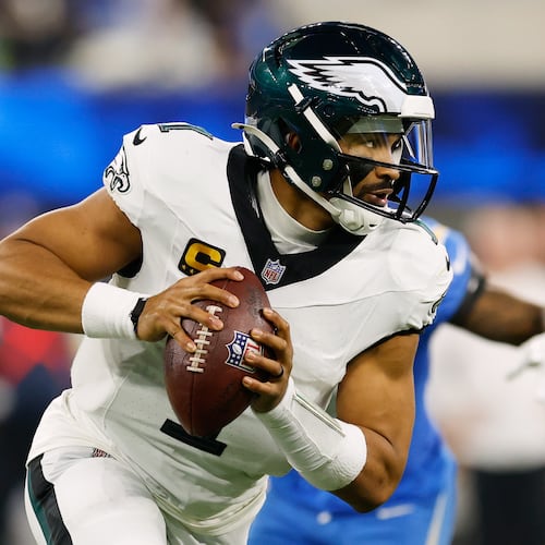 Philadelphia Eagles quarterback Jalen Hurts (1) rolls out during the second half of an NFL football game against the Los Angeles Chargers, Monday, Dec. 8, 2025, in Inglewood, Calif. (AP Photo/Caroline Brehman)