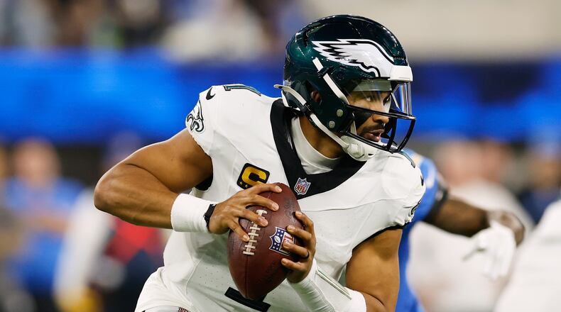 Philadelphia Eagles quarterback Jalen Hurts (1) rolls out during the second half of an NFL football game against the Los Angeles Chargers, Monday, Dec. 8, 2025, in Inglewood, Calif. (AP Photo/Caroline Brehman)