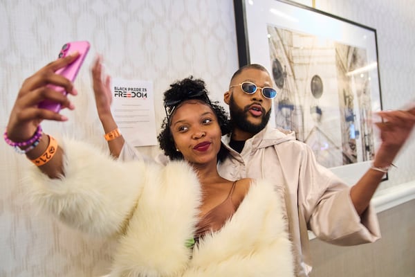 Charity Harvey, left, and Marcus Parks, both of Washington, attend the opening gala of DC Black Pride, Friday, May 23, 2025, at the Capitol Hilton in Washington. (AP Photo/Jacquelyn Martin)