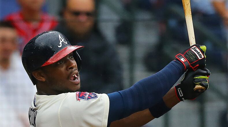 072014 ATLANTA: Braves Justin Upton hits a double against the Phillies during the second inning of an MLB game on Sunday, July 20, 2014, in Atlanta. CURTIS COMPTON / CCOMPTON@AJC.COM