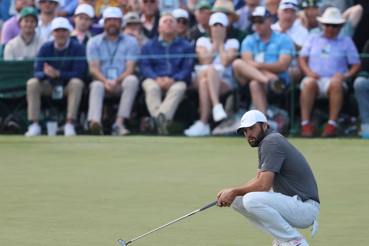 Scottie Scheffler reacts to missed putt on 16th green during third round of the Masters golf tournament, at Augusta National Golf Club, Saturday, April 12, 2025, in Augusta, Ga. (Jason Getz/AJC)
