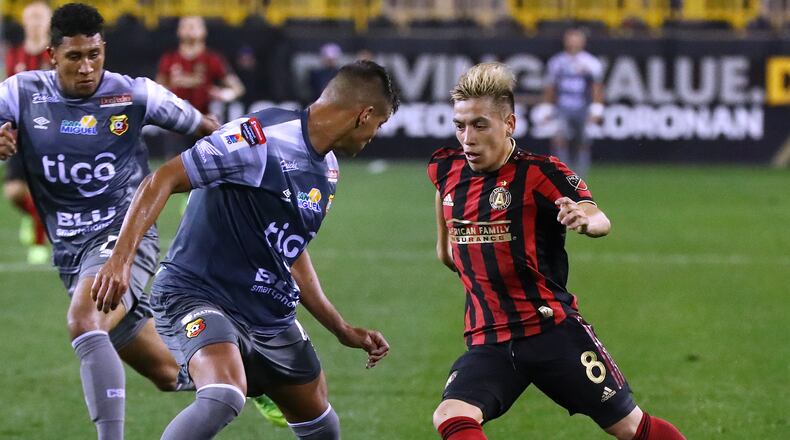 Atlanta United midfielder Esequiel Barco splits two C.S. Herediano defenders working the ball toward the goal in their Concacaf Champions League soccer match on Thursday, Feb. 28, 2019, in Kennesaw. Curtis Compton/ccompton@ajc.com