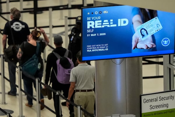 FILE - Travelers move through Hartsfield-Jackson Atlanta International Airport ahead of Memorial Day, Friday, May 24, 2024, in Atlanta.(AP Photo/Mike Stewart, File)