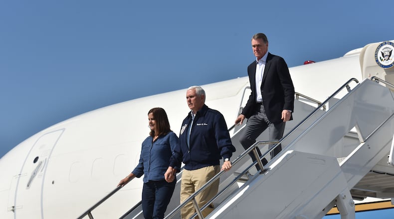 Vice President Mike Pence, second lady Karen Pence and U.S. Sen. David Perdue arrive at Southwest Georgia Regional Airport in Albany on Oct. 16, 2018. The group surveyed storm damage from Hurricane Michael. HYOSUB SHIN / HSHIN@AJC.COM