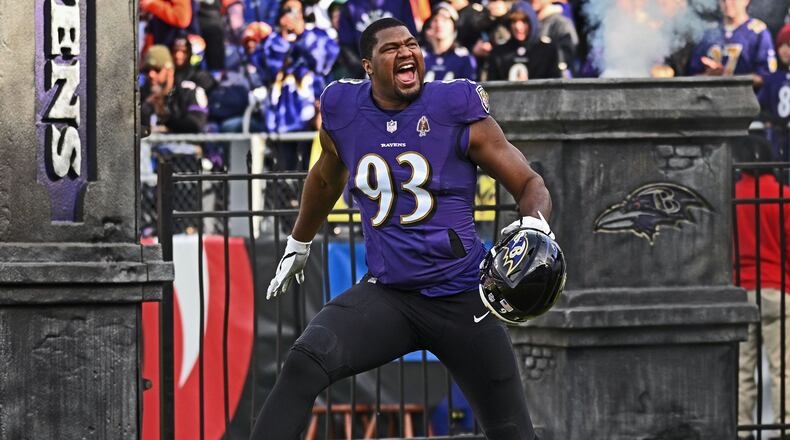 Baltimore Ravens defensive end Calais Campbell runs onto the field before a game against the Denver Broncos on Dec. 4, 2022. (Kenneth K. Lam/The Baltimore Sun/TNS)