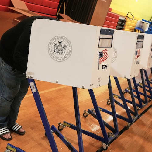 A voter marked his ballot at a voting site, in New York, Tuesday, Nov. 4, 2025. (AP Photo/Richard Drew)