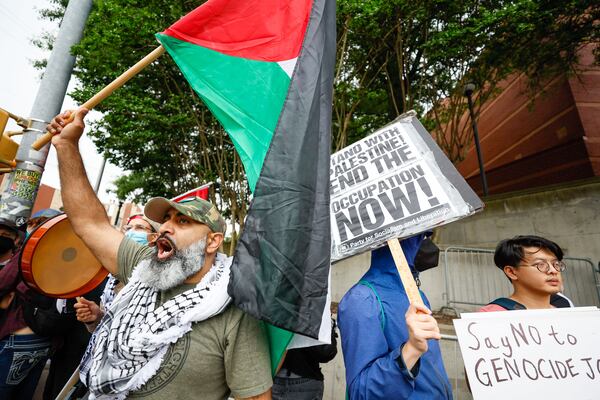 Dozens of people chant as they stand on Joseph E. Lowery Boulevard outside Morehouse College as they protest against President Joe Biden’s visit, who is the main speaker for Morehouse College’s 140th Commencement ceremony on Sunday, May 19, 2024.
(Miguel Martinez / AJC)
