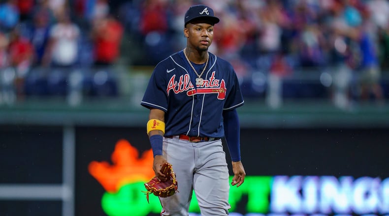 Atlanta Braves right fielder Ronald Acuna Jr. walks off the field following the team's baseball game against the Philadelphia Phillies, Wednesday, June 9, 2021, in Philadelphia. The Phillies won 2-1. (AP Photo/Chris Szagola)