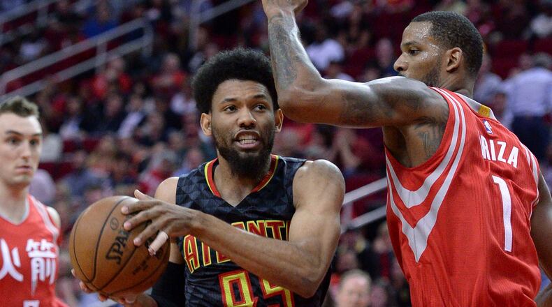Atlanta Hawks forward DeAndre Bembry (95) drives against Houston Rockets forward Trevor Ariza (1) during the second half of an NBA basketball game Thursday, Feb. 2, 2017, in Houston. (AP Photo/George Bridges)