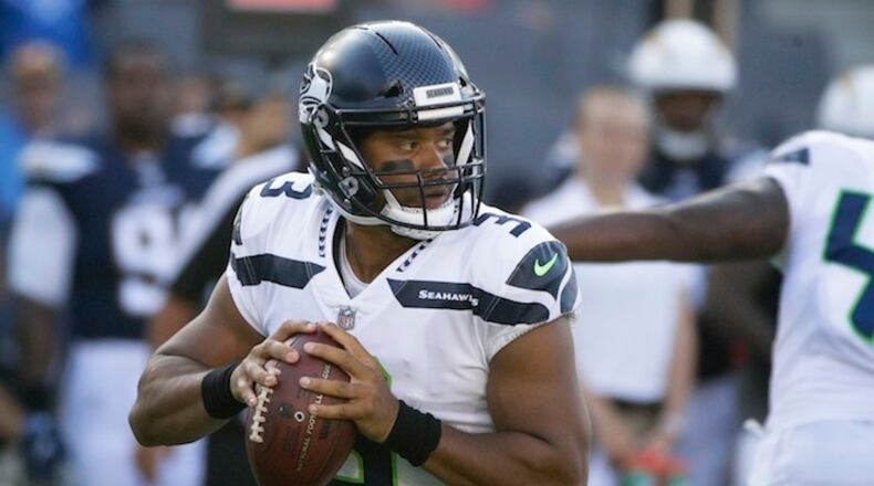 Seattle Seahawks quarterback Russell Wilson (3) throws a pass during the first half of an NFL football game against the Los Angeles Chargers Sunday, Aug. 13, 2017, in Carson, Calif. (AP Photo/Jae C. Hong)
