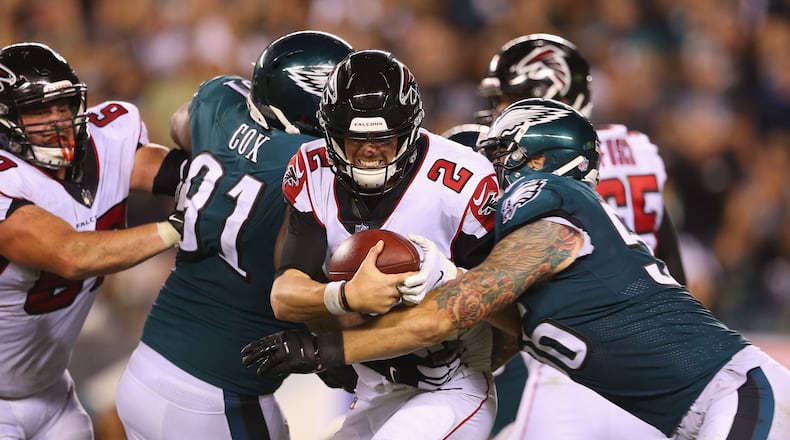 Falcons' Matt Ryan is sacked by the Eagles' Chris Long during the 2018 season opener at Lincoln Financial Field in Philadelphia. The teams will meet again in the 2019 season in Atlanta.