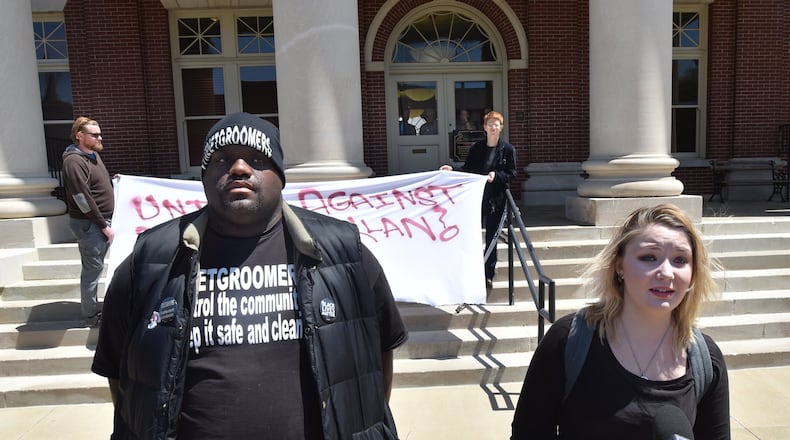 Samantha Binion (right) of Newnan and Haroun Wakil of Atlanta speak to the press outside the Coweta County courthouse during a press conference opposing the neo-Nazi rally planned for Saturday. Hyosub Shin / hshin@ajc.com