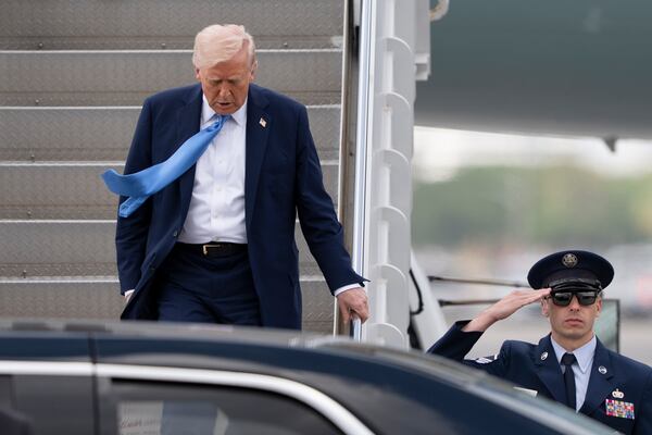 President Donald Trump arrives on Air Force One at Palm Beach International Airport, Friday, March 28, 2025, in West Palm Beach, Fla. (AP Photo/Manuel Balce Ceneta)