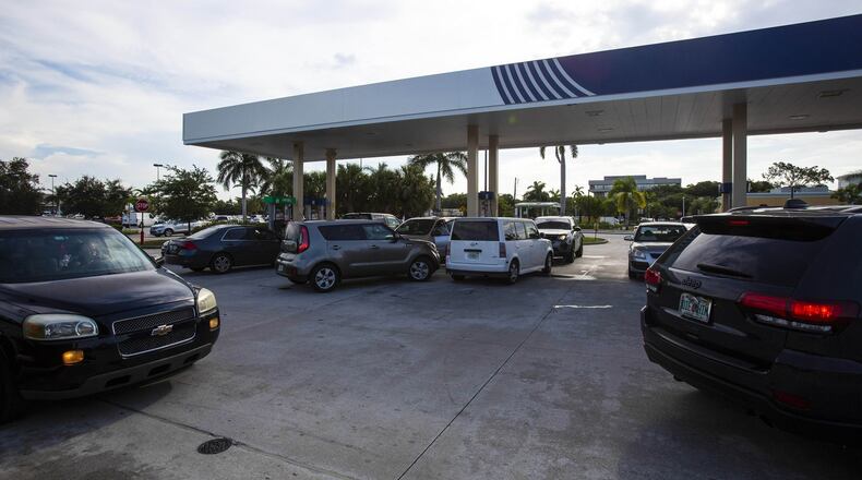 Lines form at a gas station in Lake Worth, Fla., on Aug. 29, 2019, as Hurricane Dorian approaches the Florida coast. Dorian is moving northwest and currently drawing strength from the warm waters of the Atlantic. It is expected to make landfall in Florida on Sept. 2. Georgians are keeping an eye on the storm and also preparing for a possible influx of evacuees from Florida. SAUL MARTINEZ / THE NEW YORK TIMES)