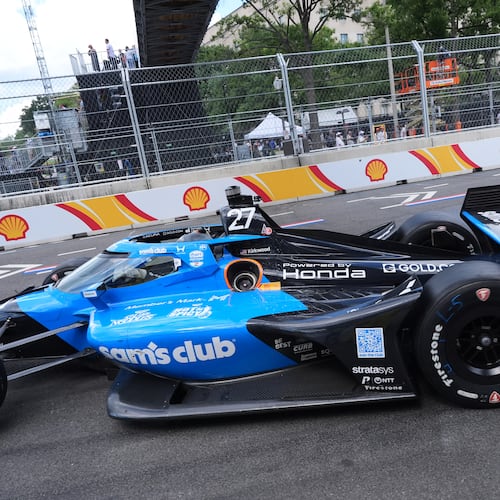 Kyle Kirkwood (27) makes a pit stop for gas during the IndyCar Freedom 250 Grand Prix auto race in Washington, Sunday, Aug. 23, 2026. (AP Photo/Alex Brandon)