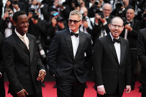 Micheal Ward, from left, Joaquin Phoenix and director Ari Aster pose for photographers upon arrival at the premiere of the film 'Eddington' at the 78th international film festival, Cannes, southern France, Friday, May 16, 2025. (Photo by Lewis Joly/Invision/AP)
