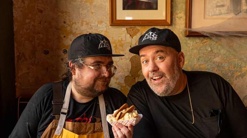 Gene's owners Avery Cottrell (left) and Matt Christensen (right) with Biscoff Banana Pud-Pud. (Aaliyah Man for The Atlanta Journal-Constitution)
