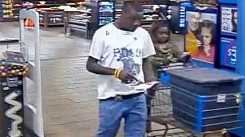 Inside a gray plastic bin, the duo allegedly concealed 33 iPads and left the store. (Photo: Covington police)