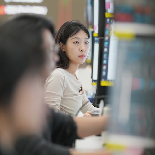 A dealer watches computer monitors at a dealing room of Hana Bank in Seoul, South Korea, Monday, May 4, 2026. (AP Photo/Lee Jin-man)