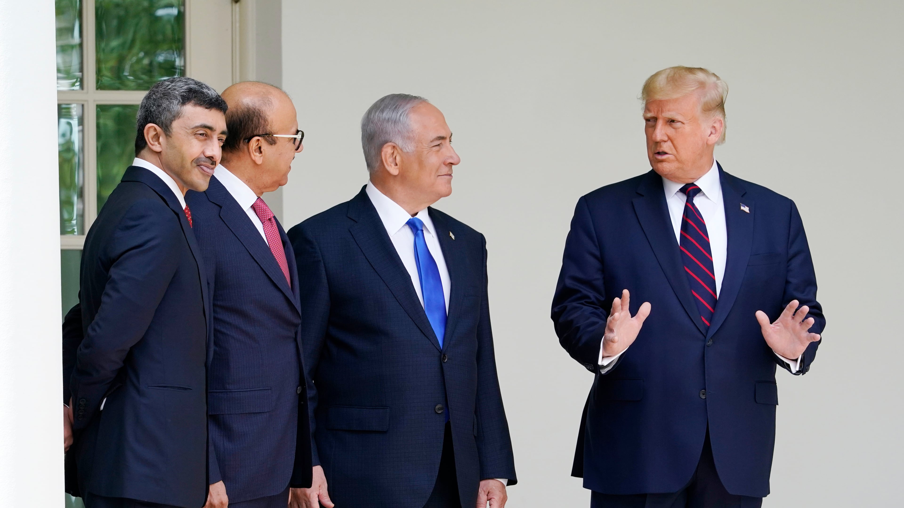 FILE - President Donald Trump, far right, walks to the Abraham Accords signing ceremony, from left, United Arab Emirates Foreign Minister Abdullah bin Zayed Al Nahyan, Bahrain Foreign Minister Khalid bin Ahmed Al Khalifa and Israeli Prime Minister Benjamin Netanyahu at the White House on Sept. 15, 2020, in Washington. (AP Photo/Alex Brandon, File)