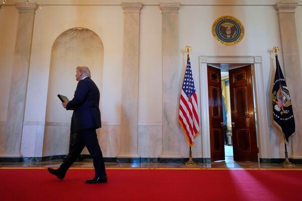 President Donald Trump arrives to speak at the Commander-in-Chief trophy presentation to the Navy Midshipman football team in the East Room of the White House, Tuesday, April 15, 2025, in Washington. (AP Photo/Alex Brandon)