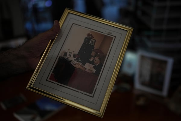 Kamran Afary, an associate professor of communication at California State University, Los Angeles, who immigrated from Iran in the 1970s, shows a photo of his grandfather in his apartment in the "Tehrangeles" neighborhood of Los Angeles, Sunday, June 29, 2025. (AP Photo/Jae C. Hong)