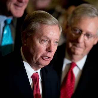 Sen. Lindsey Graham — pictured alongside Sen. Mitch McConnell in 2017 — died Saturday night of what the preliminary medical examiner report says was a tear in his aorta. (Andrew Harnik/AP)